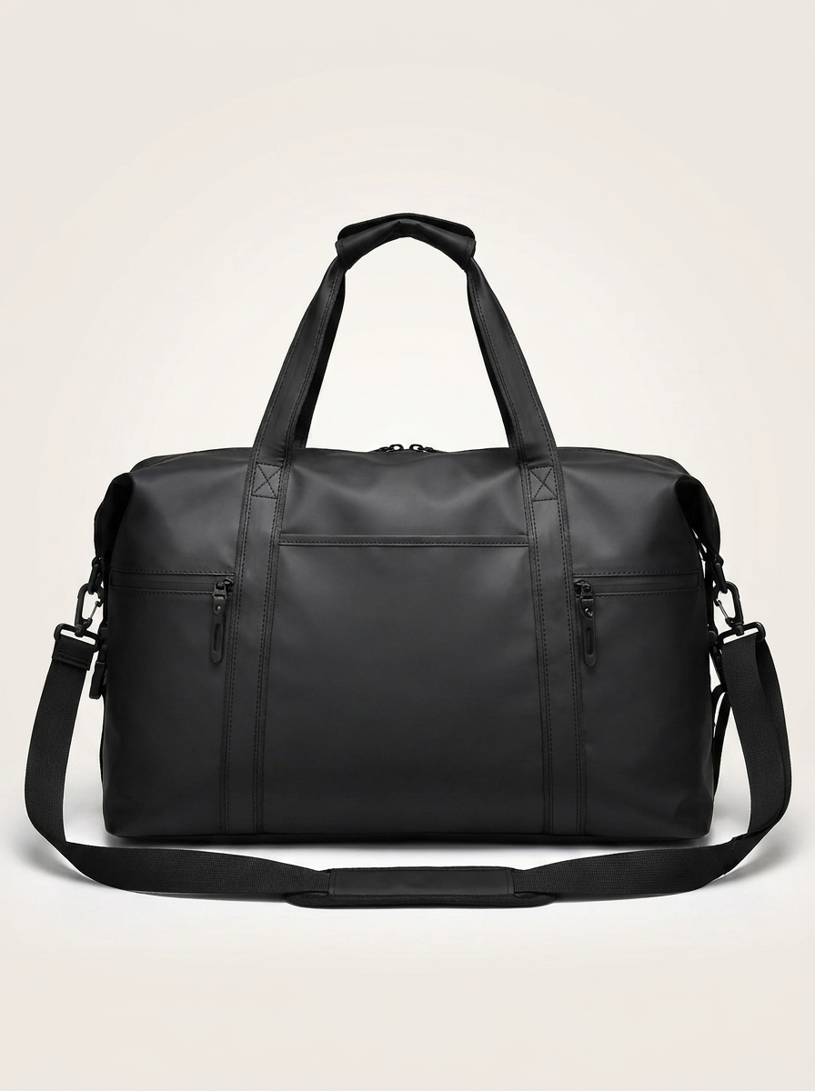 Black travel holdall with twin handles and detachable shoulder strap