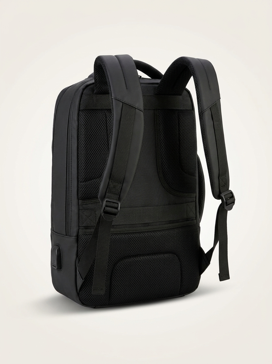 Polyester-lined 20-35L compartment holding a 16-inch laptop and essentials