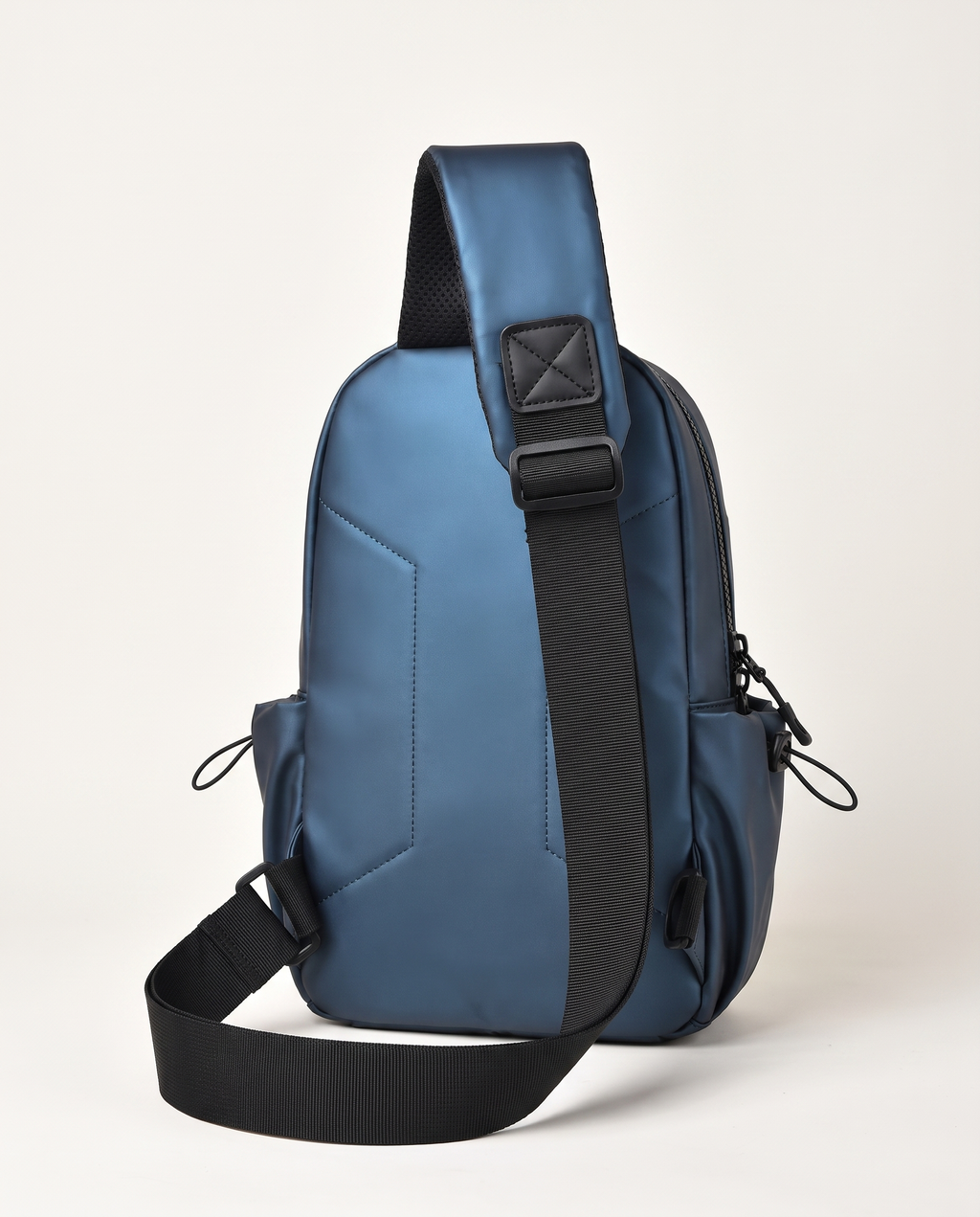 Chest bag with single adjustable sling strap worn across chest or shoulder