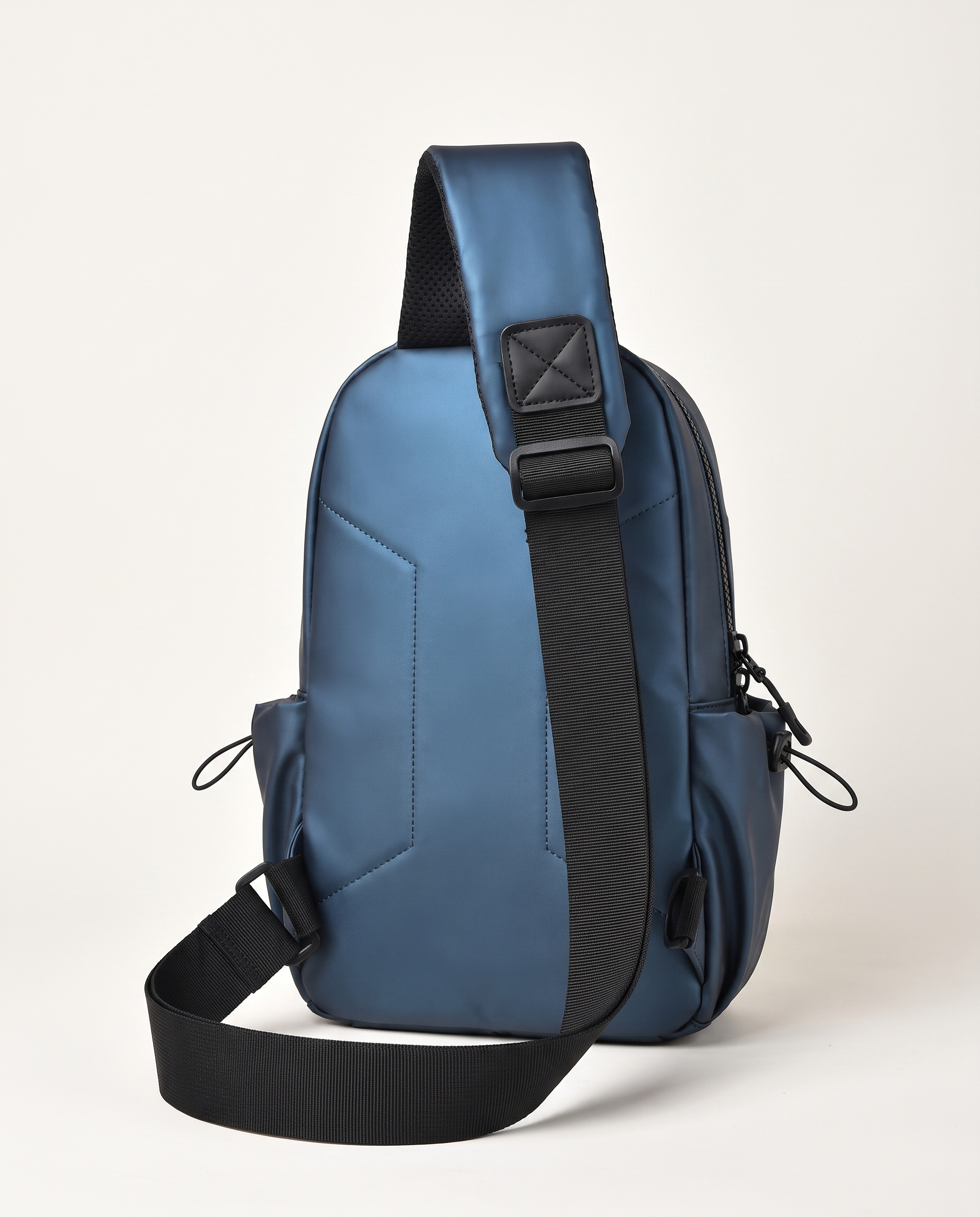 Chest bag with single adjustable sling strap worn across chest or shoulder
