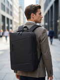 Commuter backpack with a reflective safety strip for visibility on dark journeys