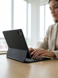 Slim magnetic floating keyboard case turning an iPad into a compact laptop