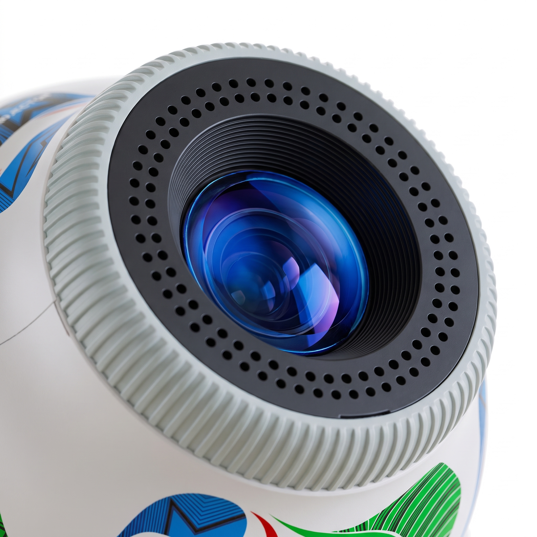 Macro close-up of the football mini projector's coated glass lens and ribbed focus barrel